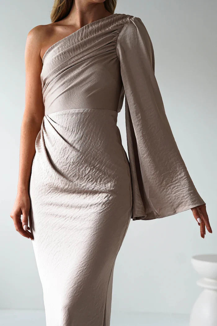 A single long sleeved tight fitting ankle bridesmaid dress suitable for attending weddings
