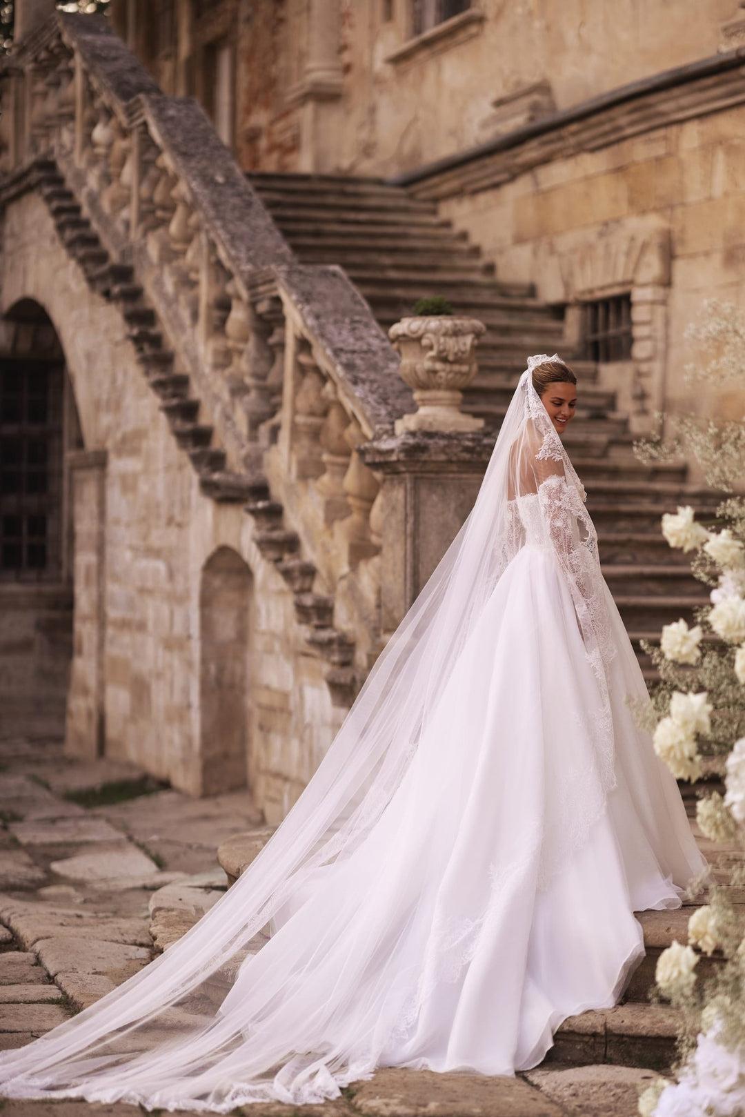 Ivory A-Line Bridal Gown with Embellished Corset and Seamless Skirt Flow
