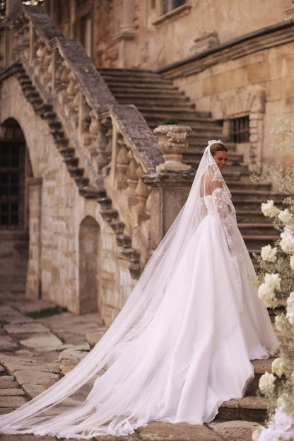 Ivory A-Line Bridal Gown with Embellished Corset and Seamless Skirt Flow