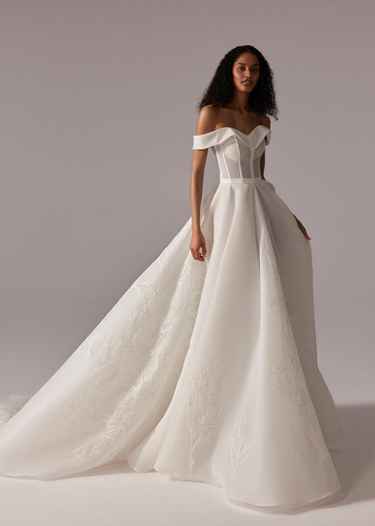 White Off-Shoulder Ball Gown Wedding Dress with Embroidered Skirt and Dramatic Train