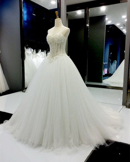 pearl beaded sweetheart see through princess wedding dresses